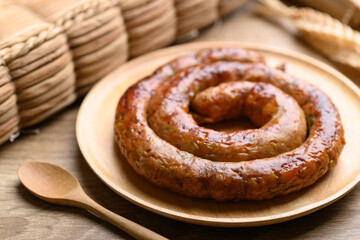Northern Thai sausage (Sai Aua), Grilled intestine stuffed with minced pork, spices and herbs, popular food in Chiangmai, Thailand