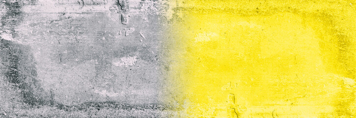 Nice concrete background toned yellow and gray color, natural textured surface.New colors of 2021 year