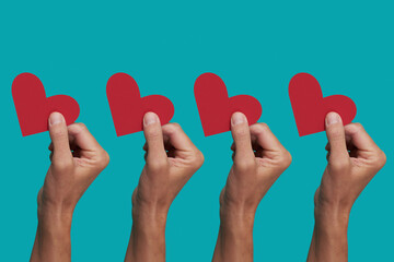 men with a red heart in their hands