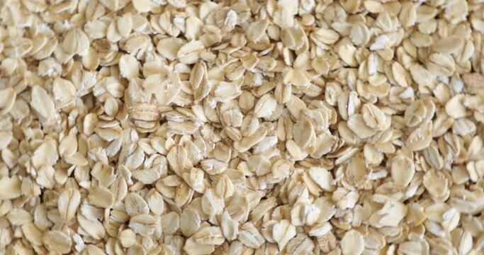 Top view of dry raw oat flakes