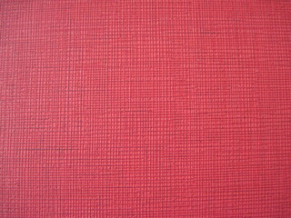 fabric texture background. simple linen textured backdrop in bright red colors.