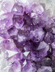 Close up view of large violet amethyst crystal cluster. Esoteric magical background concept.