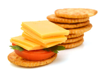Delicious crackers with cheese on white background