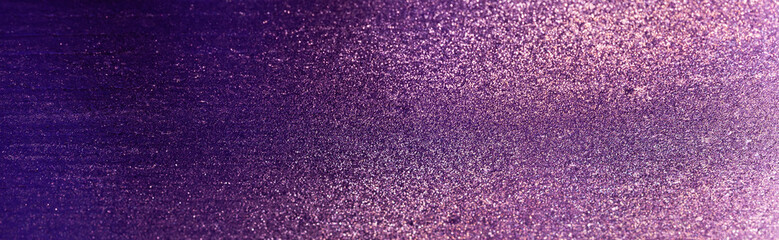 Abstract purple background with many small sparkles. Gradient from dark to light