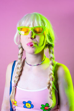 Studio Shot Hippy Playful Caucasian Woman Blowing, Popping And Chewing Bubble Gum