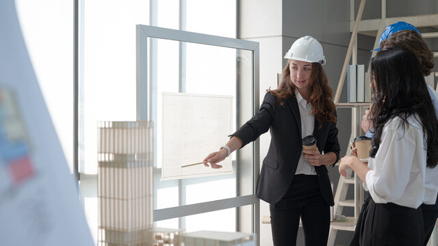 Group of diversity architect people meeting and planning a project together at the office.