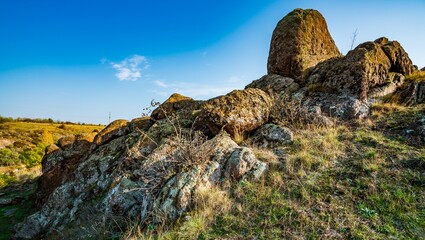 Huge deposits of stone minerals in a clearing bathed in warm sun in picturesque Ukraine