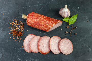 Homemade sausage top view. Pieces of cervelat