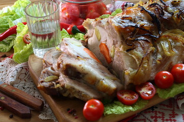 Pork pork with lettuce, cherry tomatoes on a wooden background