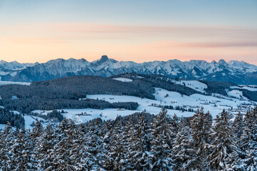 peak of Stockhorn and Emmental hills at dawn in winter