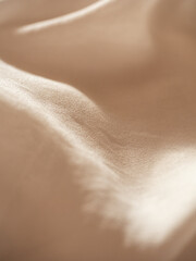 Delicate flowing milky silk with a string of baroque pearls in the morning light