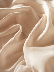 Delicate flowing milky silk with a string of baroque pearls in the morning light