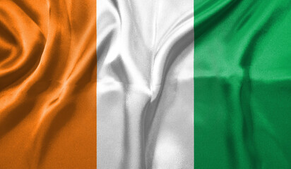 Ivory Coast flag wave close up. Full page Ivory Coast flying flag. Highly detailed realistic 3D rendering