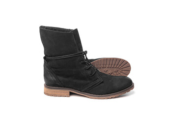 Black female winter boots isolated on a white background.