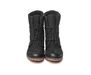 Black female winter boots isolated on a white background.