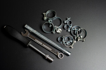 clamps in thin silver metal on a black background