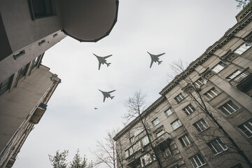 Rehearsal for May 9 Victory Parade. Three supersonic strategic bombers of long-range aviation fly over the city - 407460125