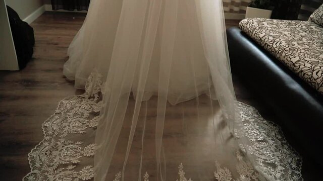 Part of the bride's white wedding dress
