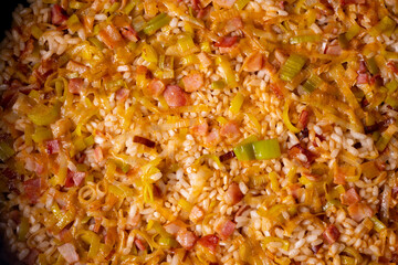 Traditional paella with vegetables and iberico ham