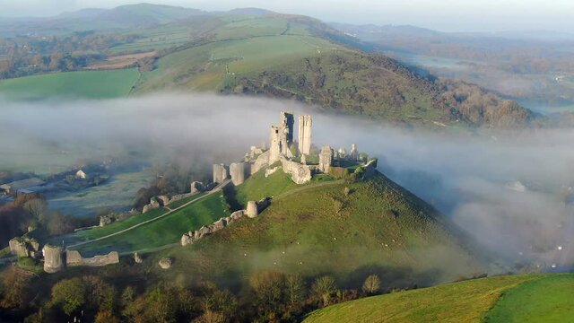 Aerial footage of Corfe Castle, Corfe, Isle of Purbeck, Dorset, England