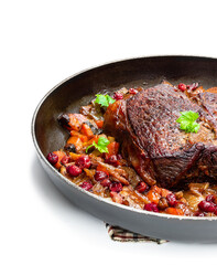 Braised beef with cranberries and vegetables isolated on white