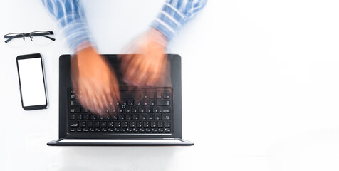 close up of a man's hands typing fast on a laptop on white background. Business and technical help concept.