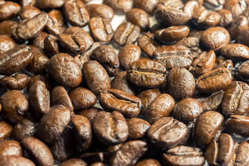 Coffee beans isolated on white background. Close up of a bean of coffee to represent the good smell.	