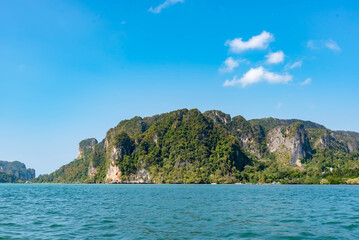 Fototapeta premium Nature in twilight period which including of sunrise over the sea and the nice beach. Summer beach with blue water and purple sky at the sunset.