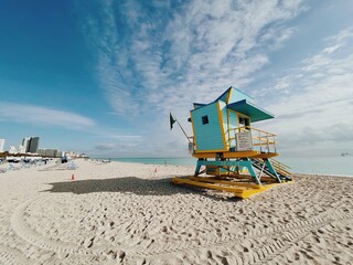 Beautiful Yellow and light blue lifeguard tower under a cloudy sunny sky in Miami Beach. Southern Florida, USA