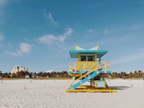 Beautiful Yellow and light blue lifeguard tower under a cloudy sunny sky in Miami Beach. Southern Florida, USA