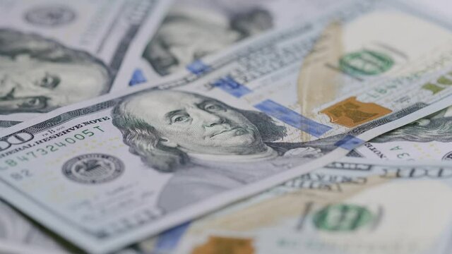 Benjamin Franklin's face on the US one hundred dollar bill