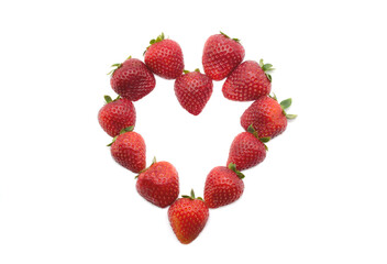 Flat lay composition in hart shape with fresh strawberries isolated on white background. Flat lay pattern, top view.