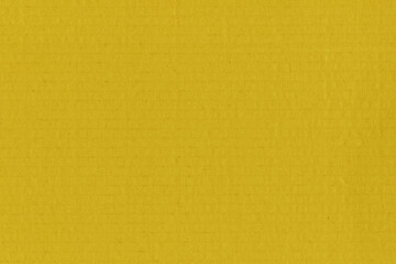 Clean yellow retro paper background. Vintage cardboard texture. Grunge paper for drawing. Simple blank fabric pattern.