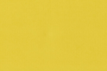 Obraz premium Clean yellow retro paper background. Vintage cardboard texture. Grunge paper for drawing. Simple blank fabric pattern.