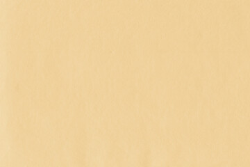 Clean yellow retro paper background. Vintage cardboard texture. Grunge paper for drawing. Simple blank fabric pattern.