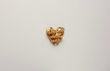 Happy Valentine's Day photography with heart shape gold foil on white background. Romantic greeting card. 