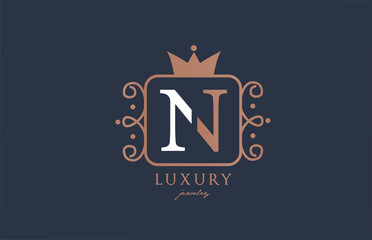N monogram alphabet letter logo icon in white and blue color. Creative design with king crown for luxury business and company