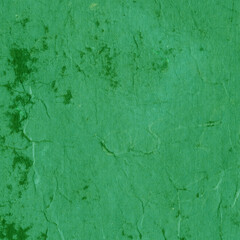 Cardboard green abstract pattern texture close-up. Retro old paper background. Grunge concrete wall. Vintage blank wallpaper.