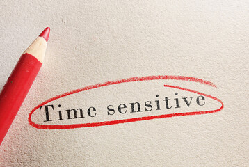 Time Sensitive text circled in red pencil on paper
