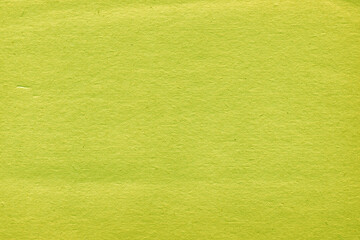 Obraz premium Cardboard green abstract pattern texture close-up. Retro old paper background. Grunge concrete wall. Vintage blank wallpaper.