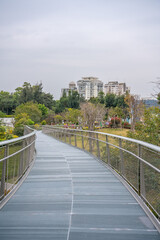 A trail on hill in a city park in Xiamen, China, on a cloudy day.