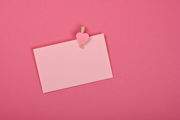 Blank Valentine paper card note on pink