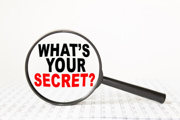 words WHAT'S YOUR SECRET in a magnifying glass on a white background. business concept