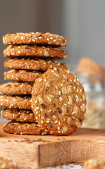 Freshly baked homemade vegan oatmeal cookies with cereals - flax seed, sesame and sunflower. Useful snack. Traditional breakfast. The concept of healthy eating. Selective Focus