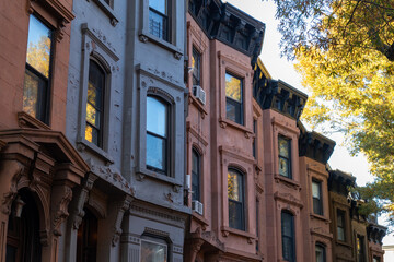Row of Colorful Old Brownstone Homes in Park Slope Brooklyn New York with Trees during Autumn