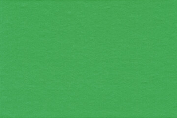 Fototapeta premium Cardboard green abstract pattern texture close-up. Retro old paper background. Grunge concrete wall. Vintage blank wallpaper.