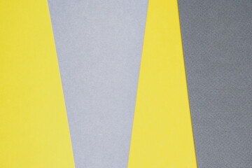Gray and yellow paper top view. Template with geometric shapes for design in trendy colors with place for text