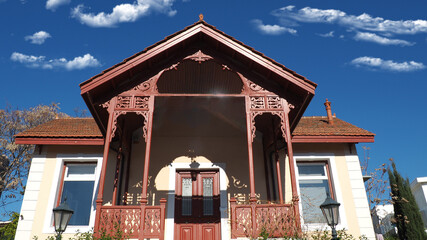 Beautiful public neoclassic tower building in Kifisia district on a blue cloudy sky, North Athens,...