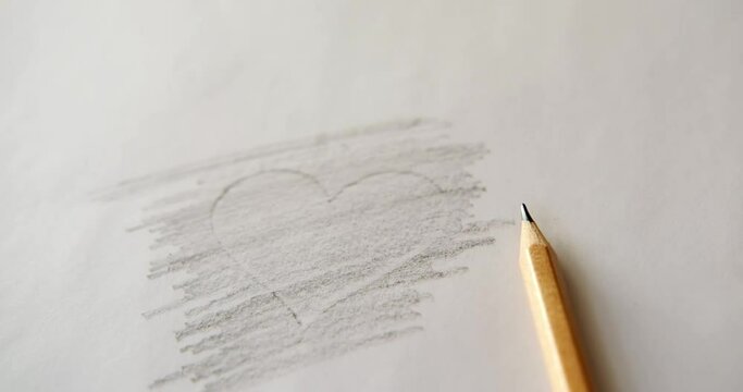 Heart drawn with a pencil on a sheet of paper.