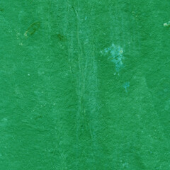 Cardboard green abstract pattern texture close-up. Retro old paper background. Grunge concrete wall. Vintage blank wallpaper.